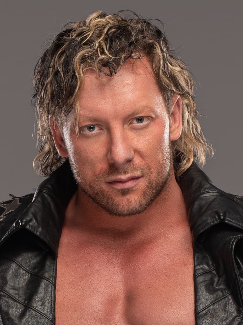 Key visual for AEW Dynamite featuring Kenny Omega with the AEW World Championship and Mercedes Moné.